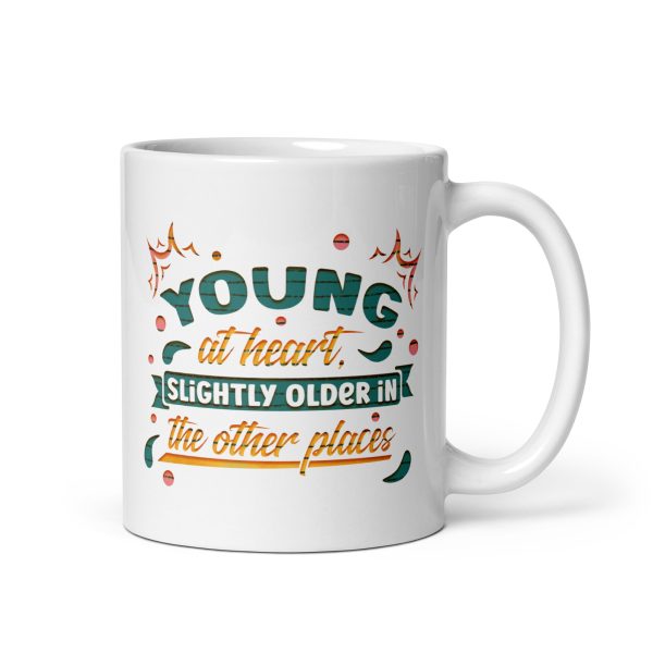 Young at heart slightly older in the other places Funny Coffee Mug / Cup