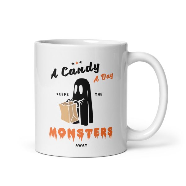 A candy a day keeps the monsters away funny Halloween coffee mug / cup